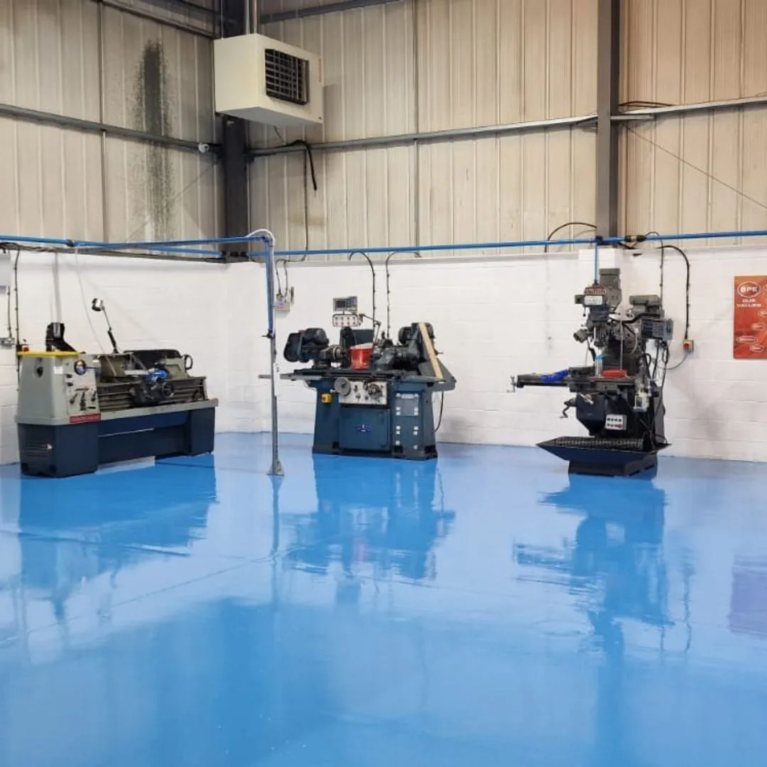 High Build Epoxy Coating - Blue Flooring in a Workshop High Build Epoxy Coating - Blue Flooring in a Workshop