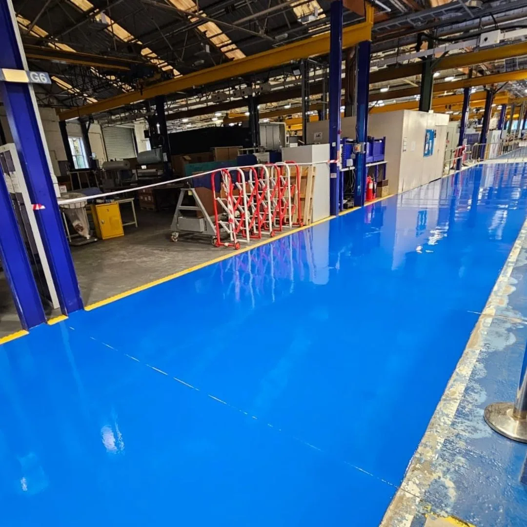 High Build Epoxy Coating - Blue Walkway through a Factory High Build Epoxy Coating - Blue Walkway through a Factory