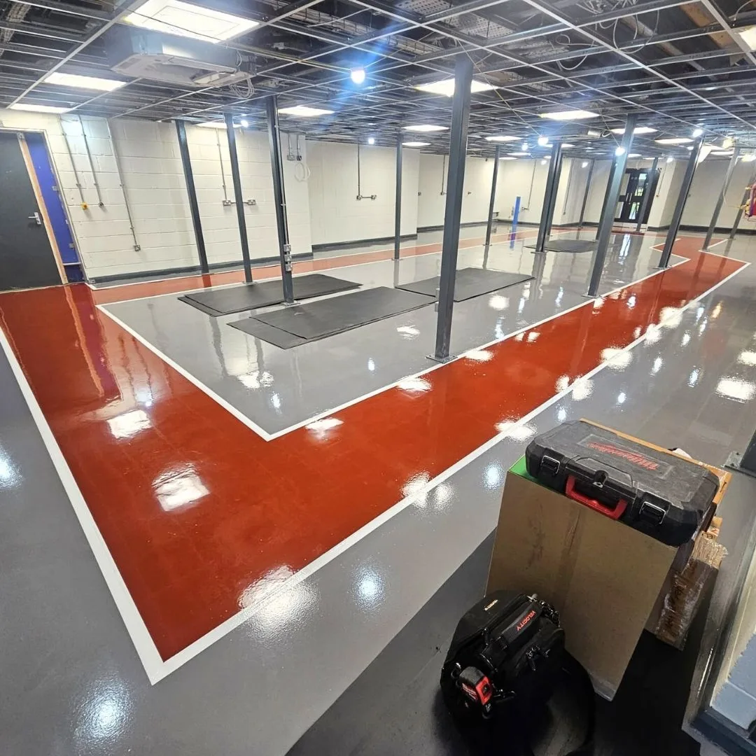 High Build Epoxy Coating - Red Walkway through a Factory High Build Epoxy Coating - Red Walkway through a Factory