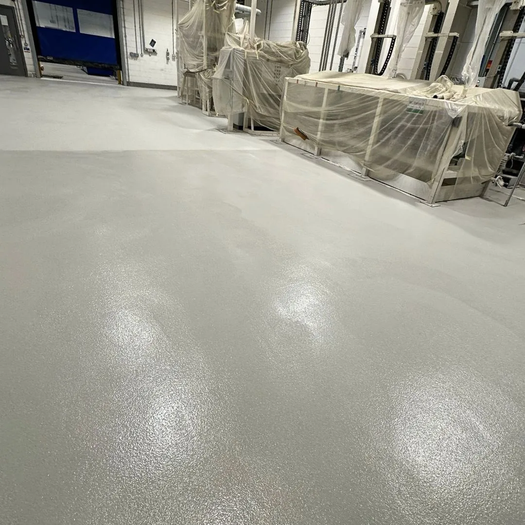 Polyurethane Cement - Grey smooth floor in a factory loading dock